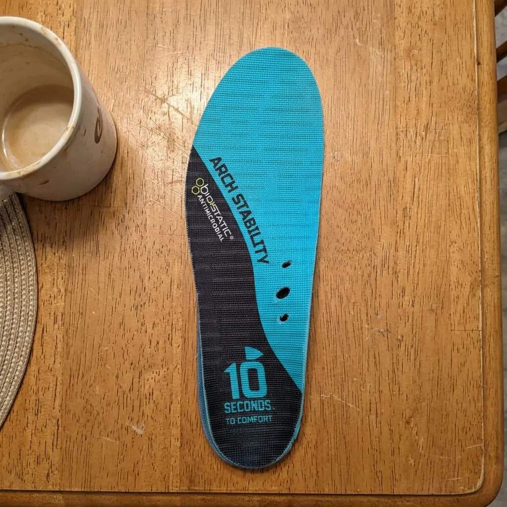 A pair of 10 Seconds 3720 Arch Stability insoles viewed from the top cover side