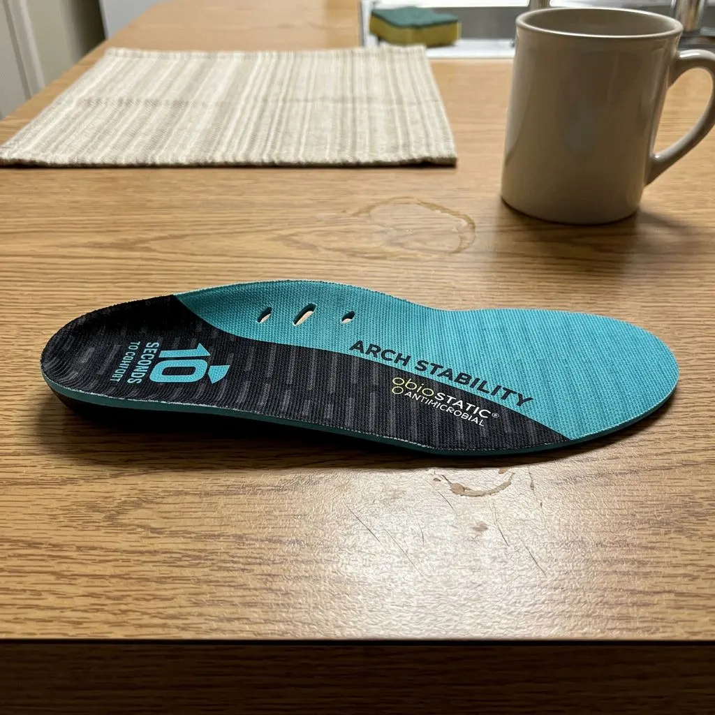 10 Seconds 3720 Arch Stability insole shown at an angle on a wood table