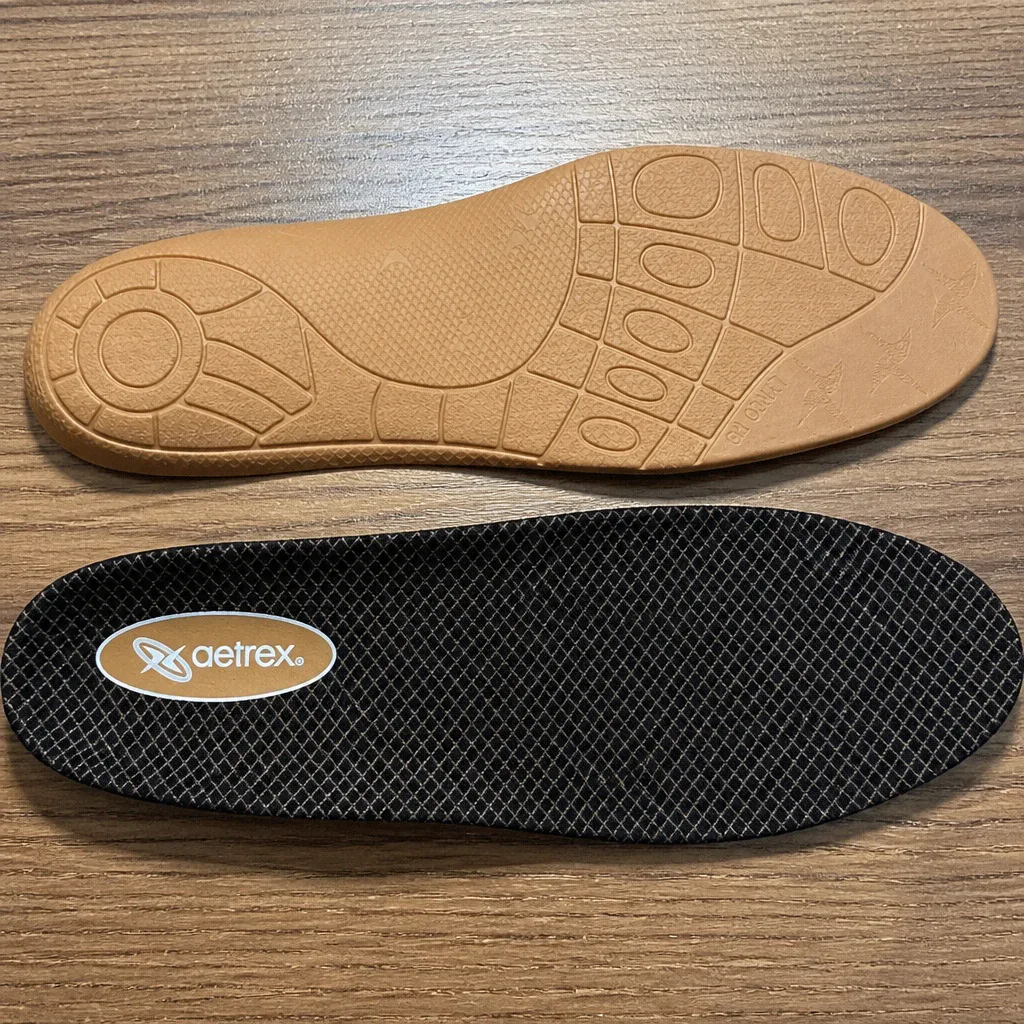 A pair of Aetrex Lynco L400 Compete orthotic insoles after three weeks of daily wear