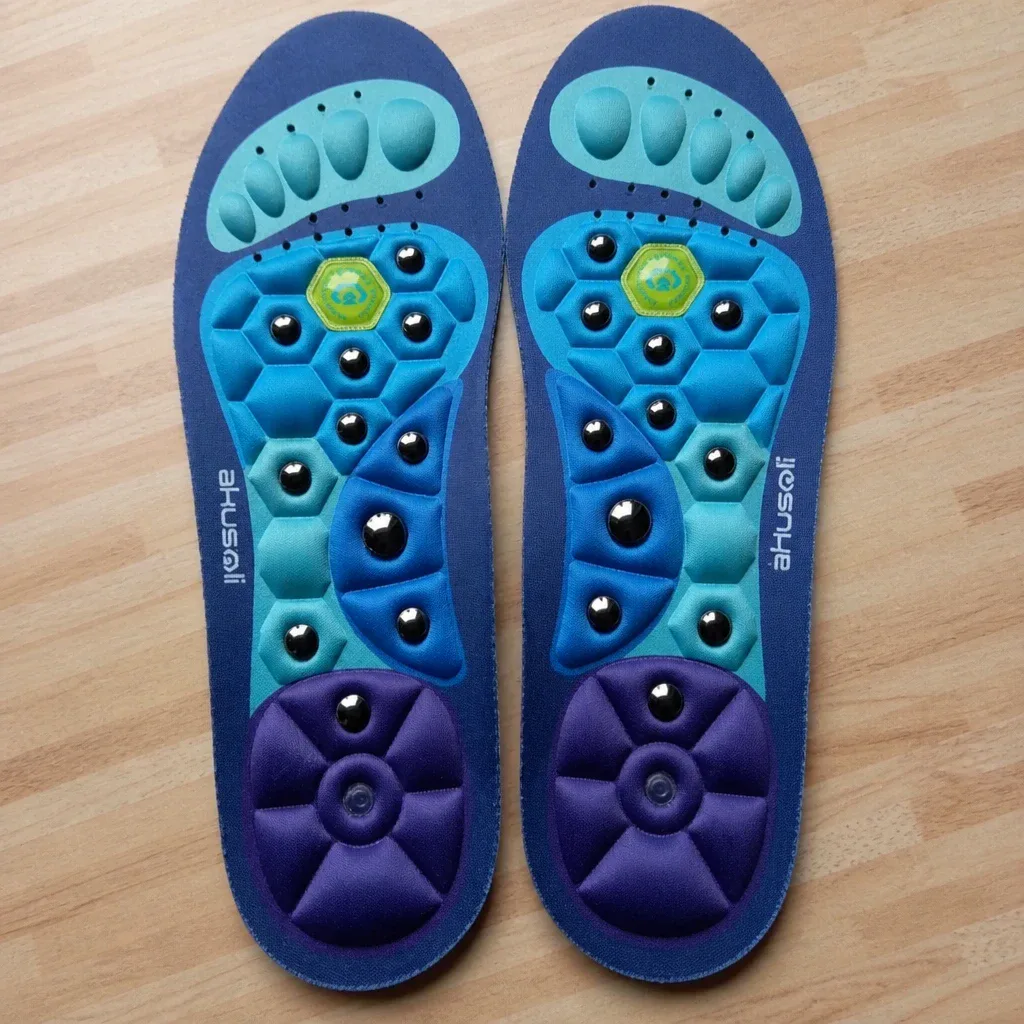 A pair of Akusoli magnetic acupressure insoles after 24 days of daily wear
