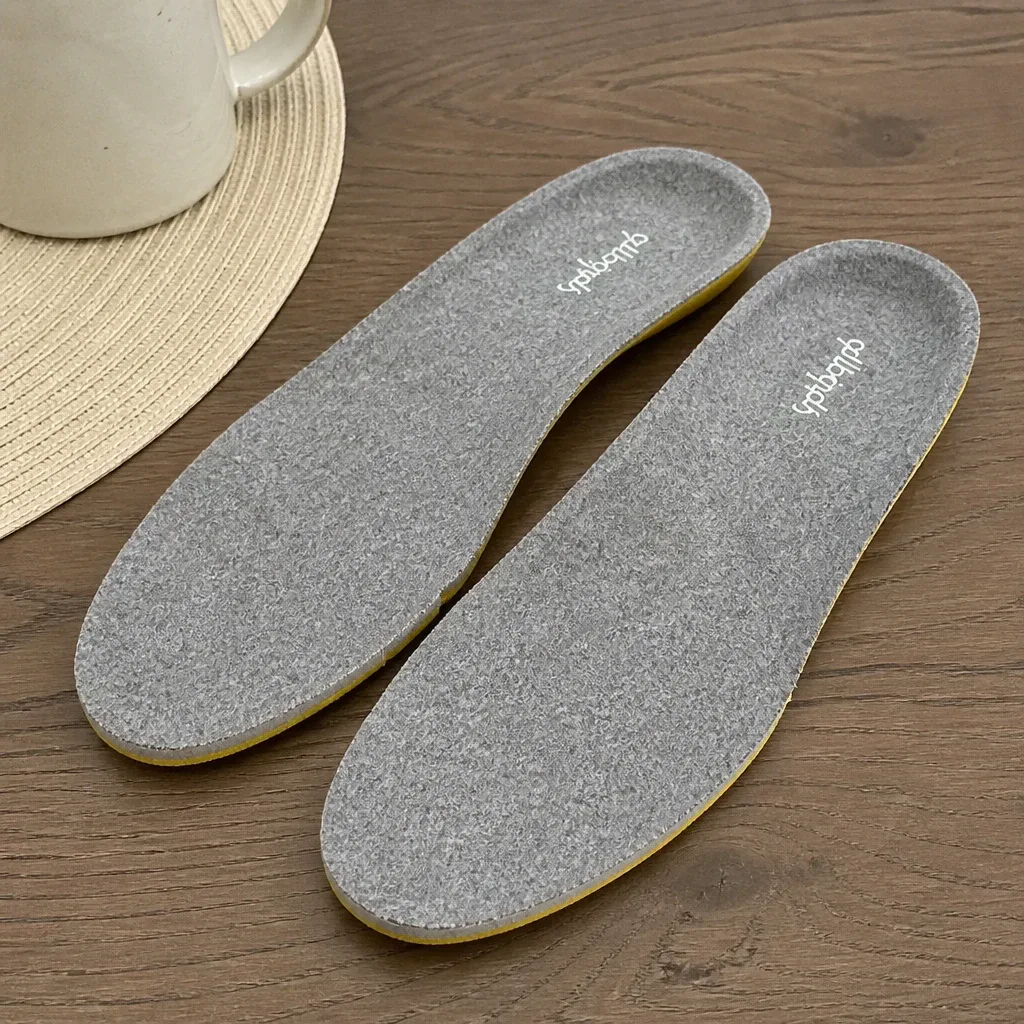 Allbirds Featherbed insoles on a kitchen table after several weeks of wear