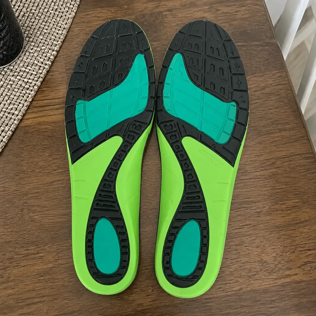 An Apex A-Wave Firm orthotic insole resting on a kitchen table after airing out overnight