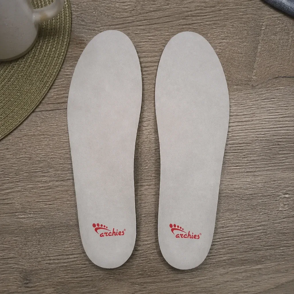 An Archies Full-Length Casual arch support insole laid flat on a kitchen table
