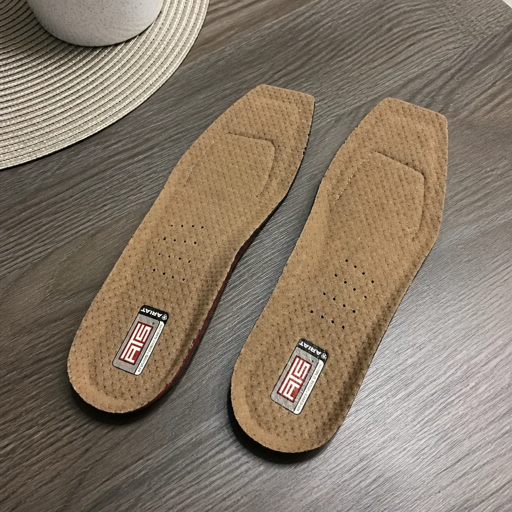 An Ariat ATS Wide Square Toe insole laid flat on a kitchen table