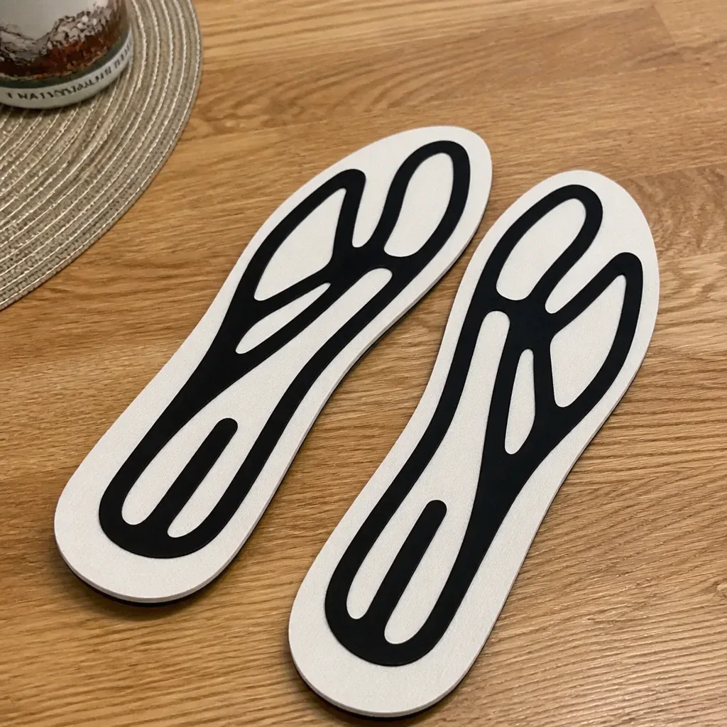 A second angle of the Aurorra by ARRIS Super Insole pair on a kitchen table
