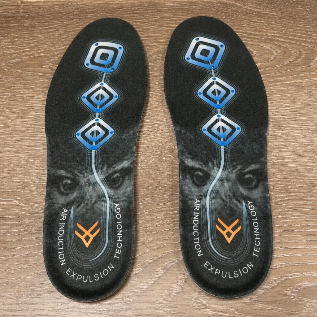 A pair of Hawx Ground Support Work Boot Insoles resting on a kitchen table after air-drying