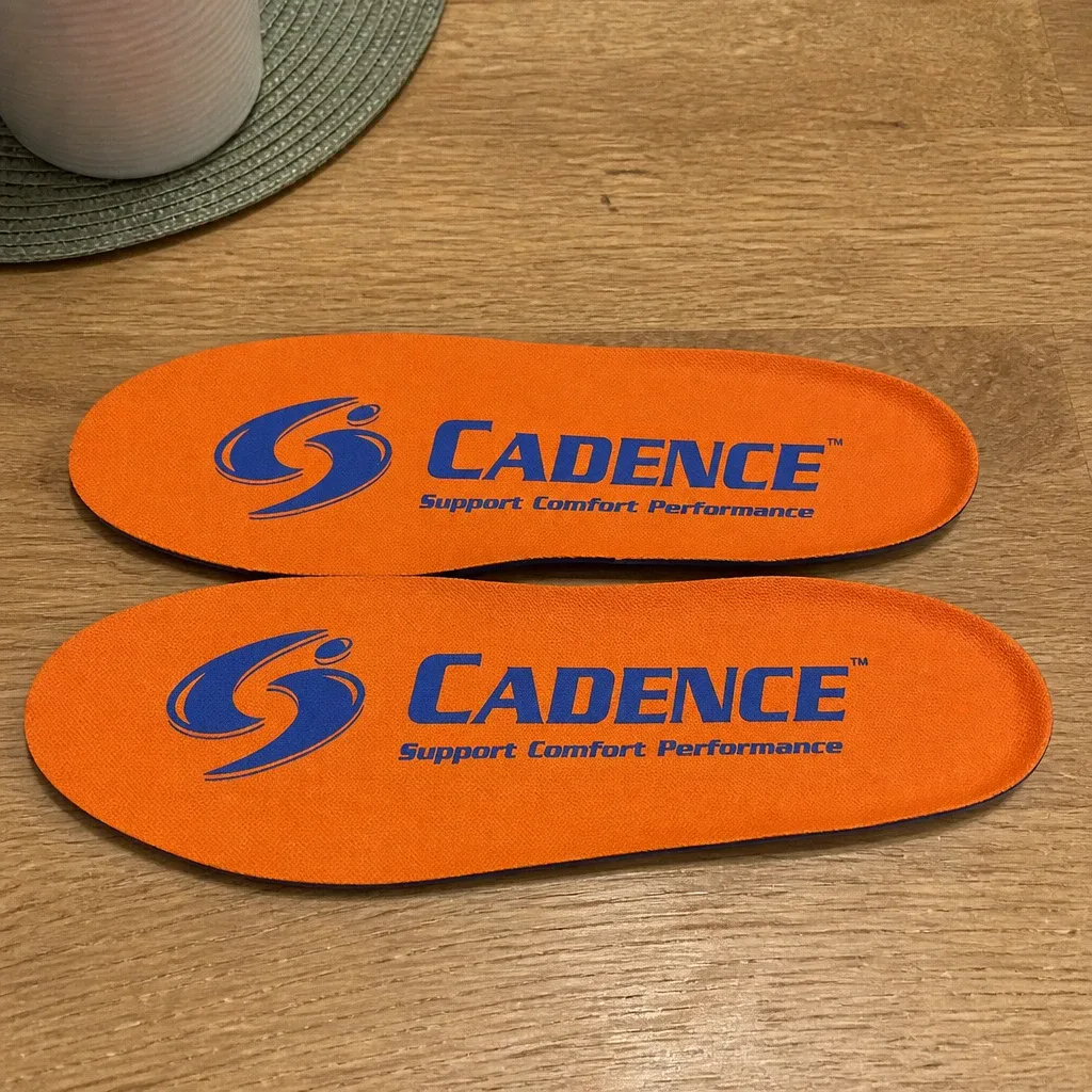 Cadence Original Orange Insoles unboxed on a kitchen table