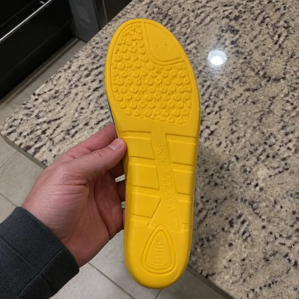 Carhartt Insite Insole flexed by hand to test arch rebound