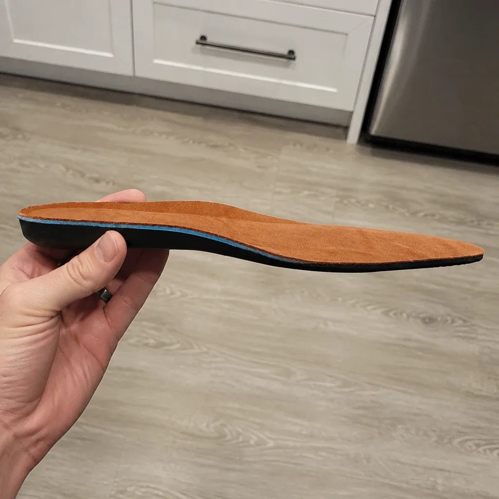 Chisos Comfort Insole viewed from the side, held in hand