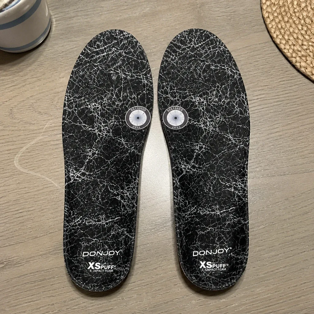 DonJoy insole laid flat on a kitchen table showing the top cover and arch shape