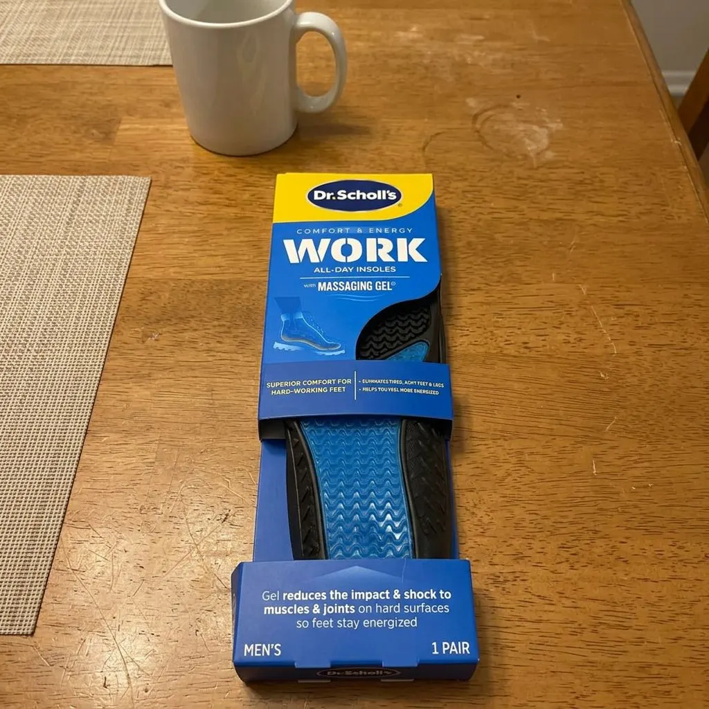 Dr. Scholl's Work All-Day Insoles with Massaging Gel retail packaging on a table
