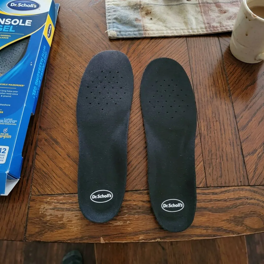 A pair of Dr. Scholl's Work All-Day insoles side by side on a table