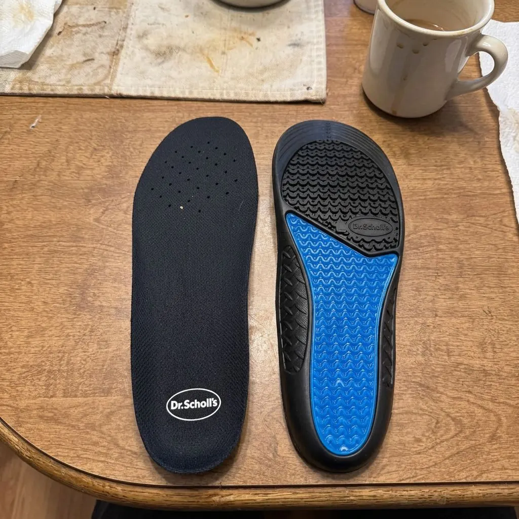 Dr. Scholl's Work All-Day insole shown from the top cover side and the gel sole side