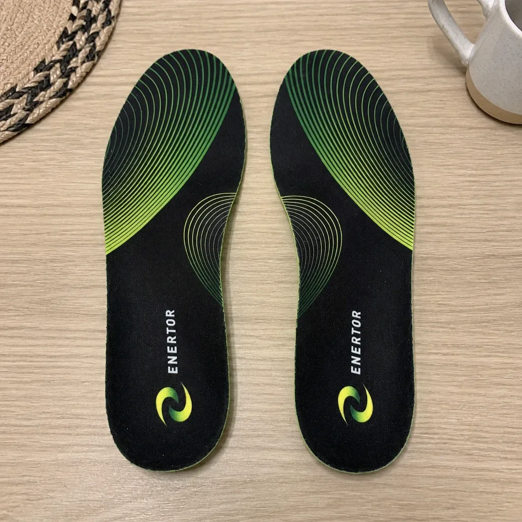 A pair of Enertor PX1 Running Insoles laid out on a kitchen table