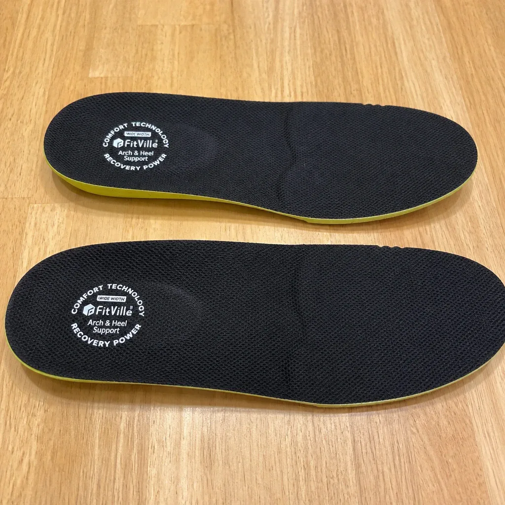 A pair of Fitville Comfort insoles laid out side by side on a kitchen table
