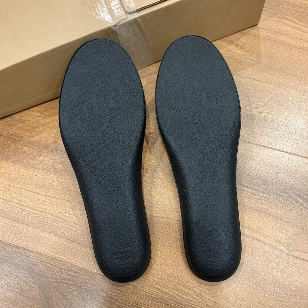 FORM insoles and their packaging on the floor