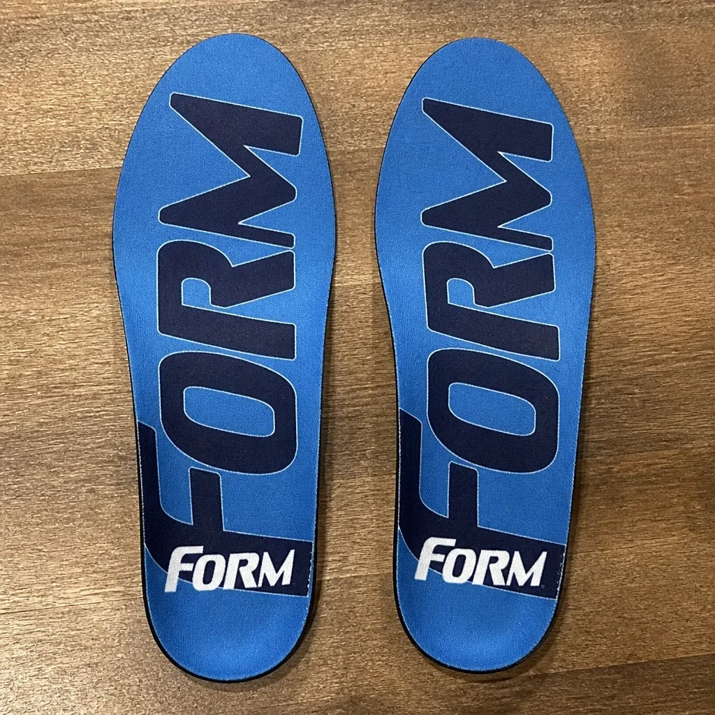 The FORM insoles on a kitchen table with the top fabric visible