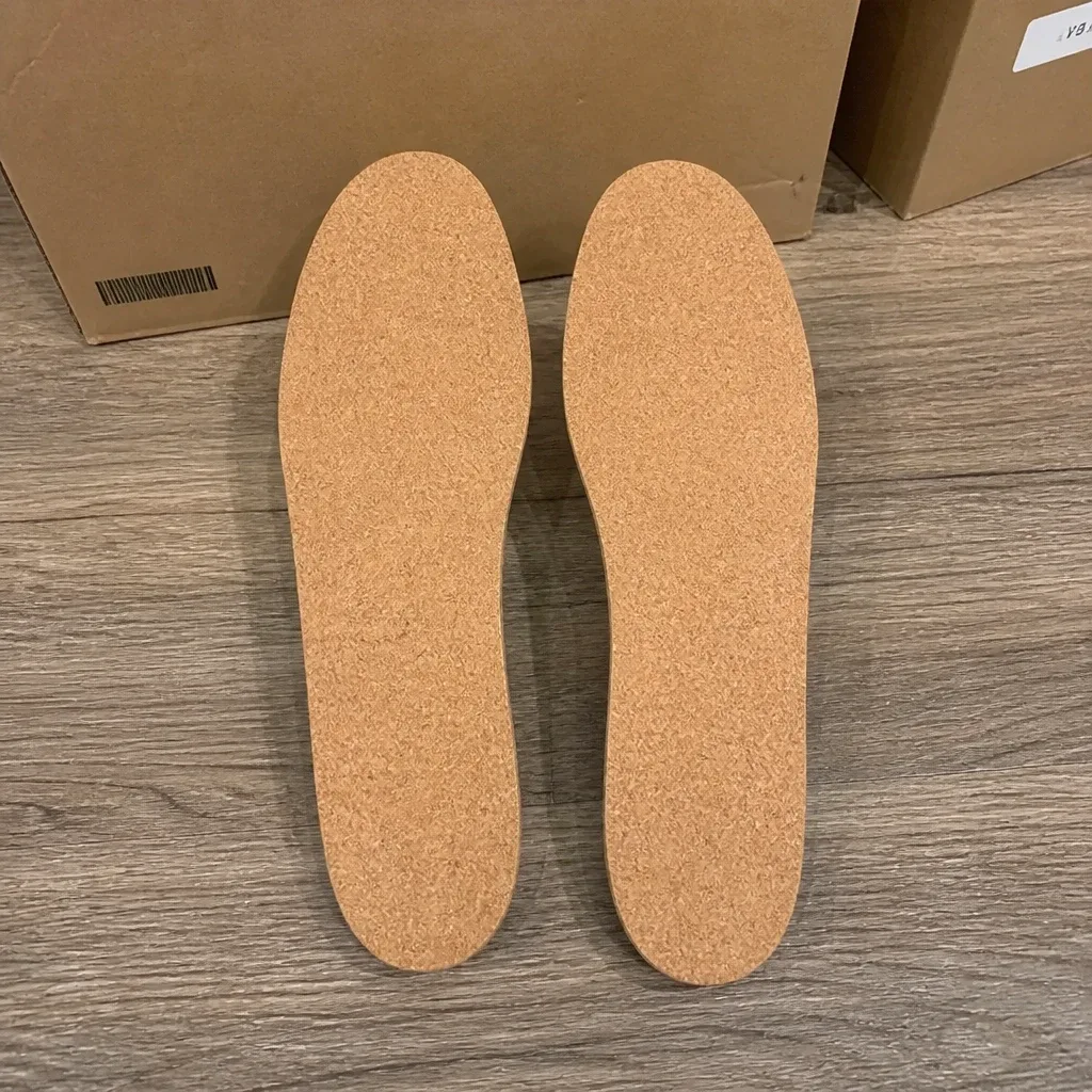 Underside of a pair of Fulton Athletic Insoles showing the bare cork base