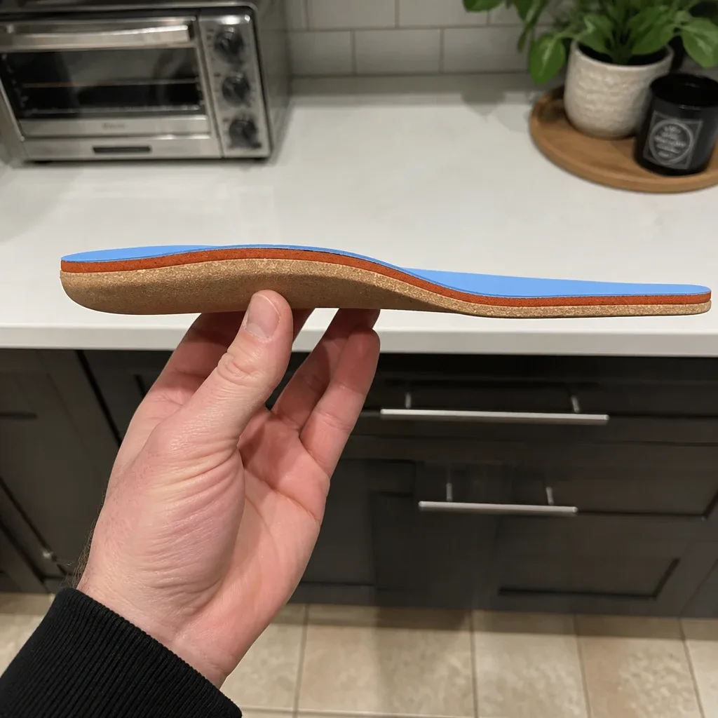 Side profile of a Fulton Athletic Insole showing the cork base, foam mid-layer, and arch contour