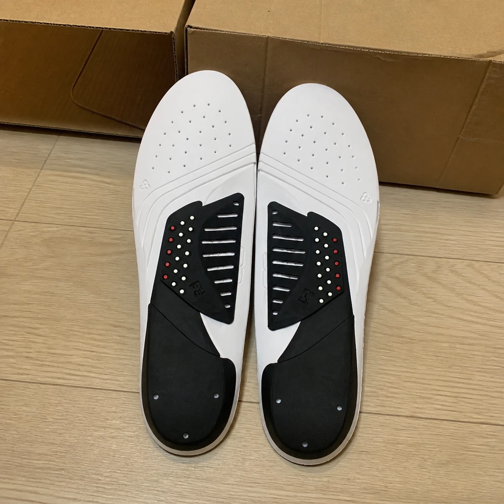 G8 Performance insoles with their packaging on the floor