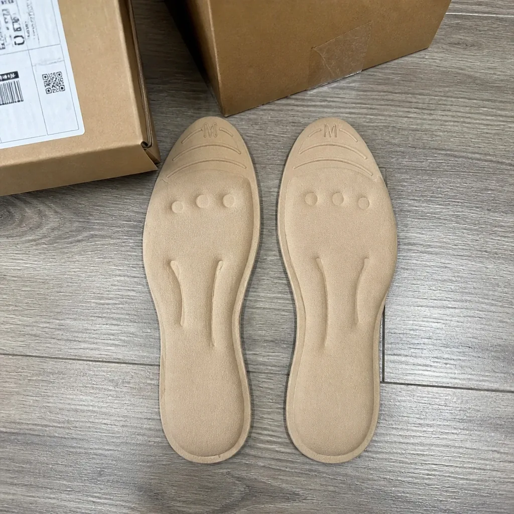 Healthy Feet insoles with their boxes on the floor