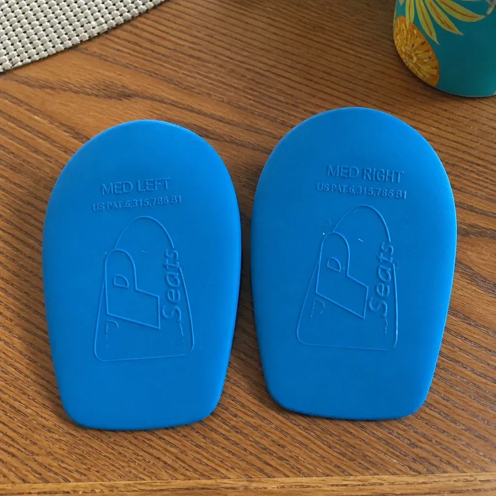 Heel That Pain Heel Seats laid out on a kitchen table