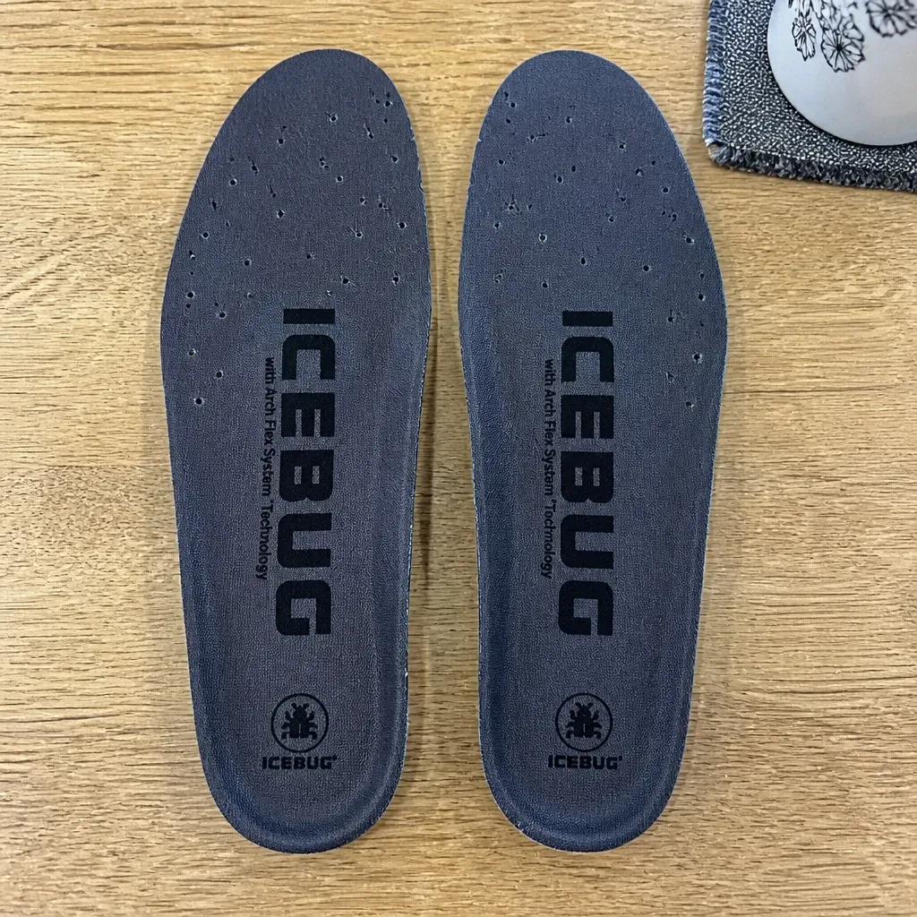 Icebug Comfort insoles on a kitchen table showing the charcoal top cover