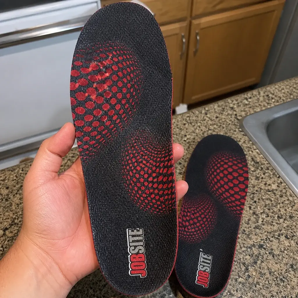 JobSite Heavy Duty insole held in hand showing the molded arch shell