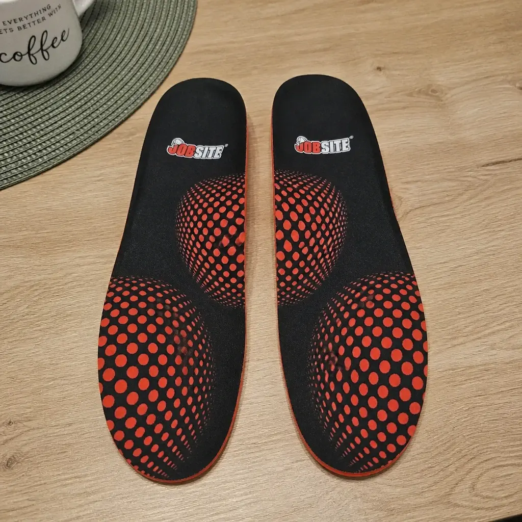 JobSite Heavy Duty insole next to a work boot on a kitchen table