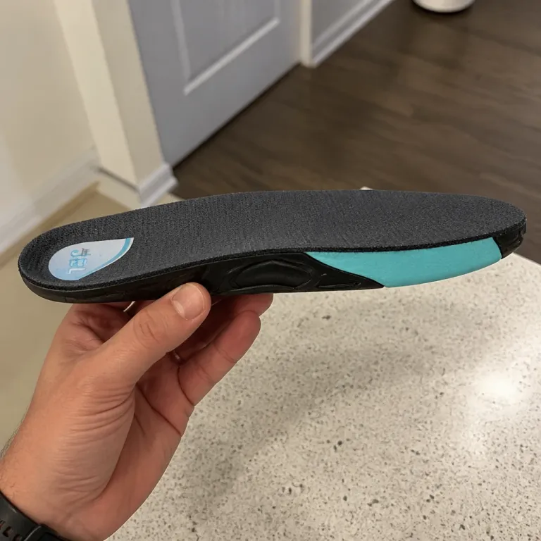 Justin Jel insert held sideways to show its thickness