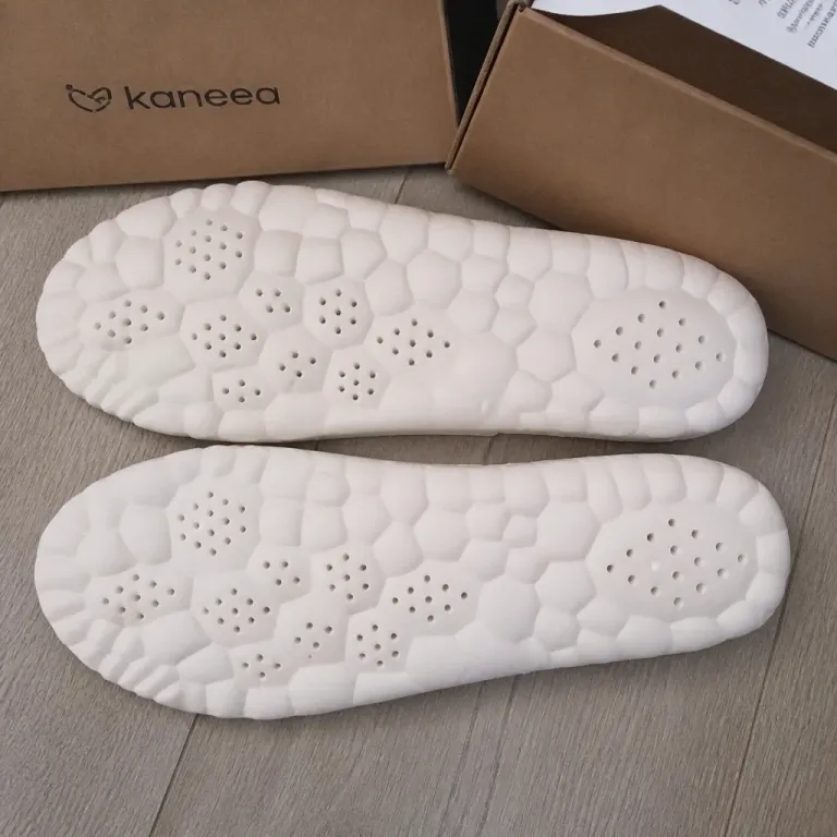 KANEEA insoles beside their boxes on the floor