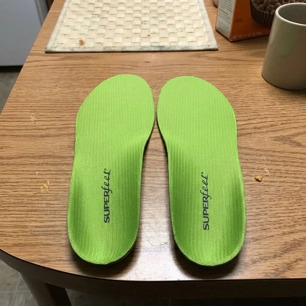 Top-down view of a pair of Superfeet All-Purpose Support High Arch insoles