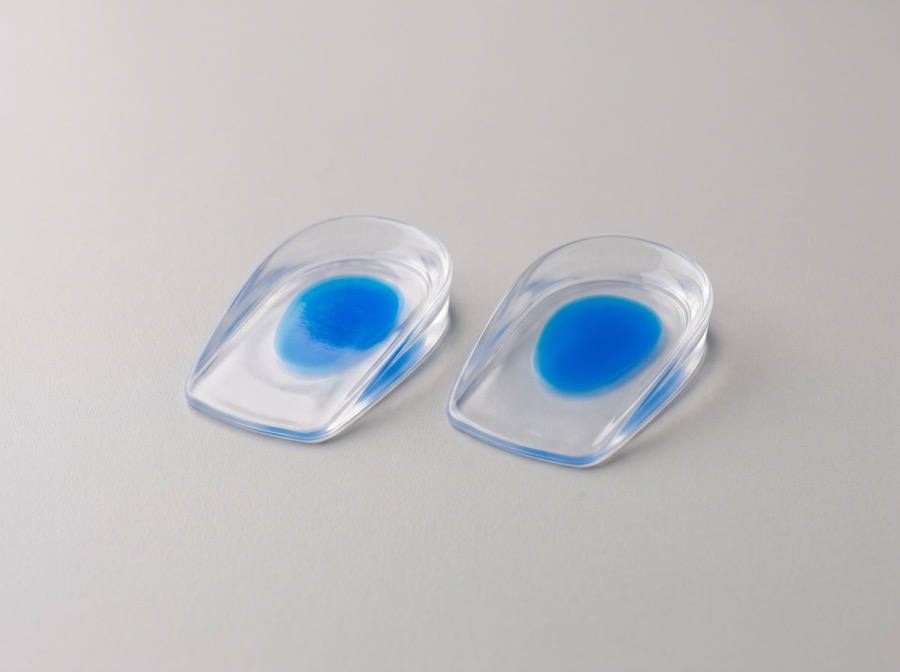Clear silicone heel cup arch support pads with blue gel centers